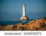 Buddhaism Guanyin statue at seaside in nanshan temple, hainan island , China, Words mean mercy and blessing.