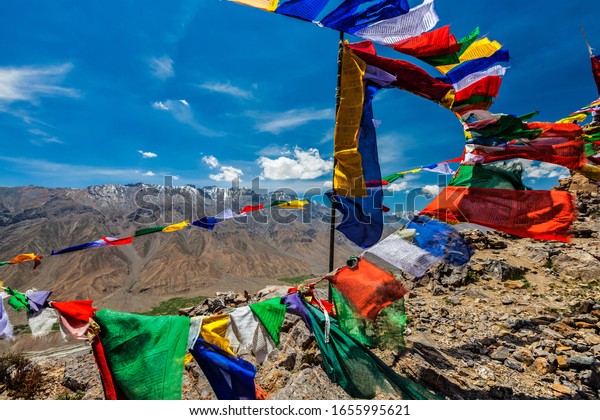 Buddhism prayer flags lungta with Buddhist mantra\
written on them in Spiti Valley in Himalayas mountains, Himachal\
Pradesh, India