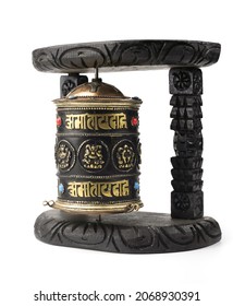 Buddhism prayer wheel in black wood isolated