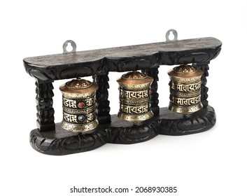 Buddhism prayer wheels in black wood isolated