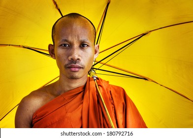 Buddhist Monk Holding Umbrella, Cambodia