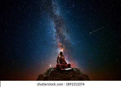 Buddhist monk looking at the universe
