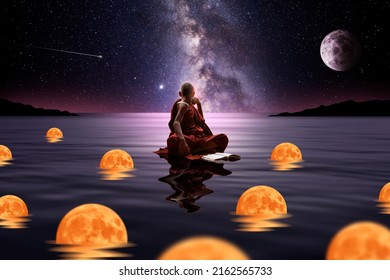 Buddhist monk sitting in the water with spheres of light