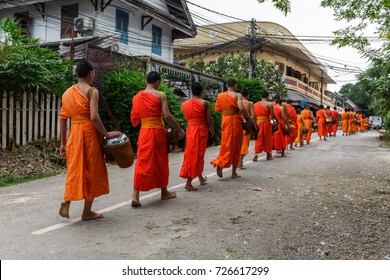 Buddhist Monks In A Line In Luang Prabang, Laos