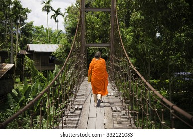 Buddhist Monks on the rope bridge