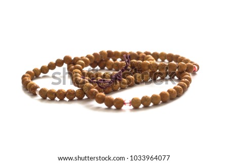 Buddhist prayer beads. 108 beads of bird cherry. Isolated on white background.
