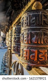 Buddhist prayer wheel with mantra sounds "Om mani padme hum", literally means 'Oh, jewel in the lotus'