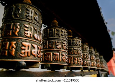 Buddhist prayer wheels Boudhanath in Nepal