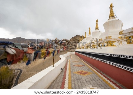 Buddhist Stupas And Prayer Flags At Thiksey Monastery In Ladakh, India.