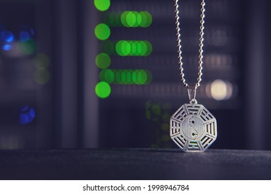 Buddhist symbol of yin and yang on the background of computer technology in the server room - Powered by Shutterstock