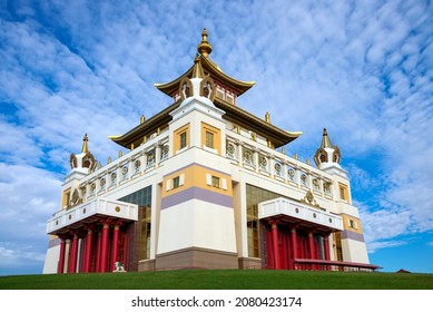 Buddhist temple "Golden Abode of Buddha Shakyamuni" against a cloudy sky. Elista, Kalmykia, Russia