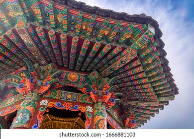 Buddhist Temple Roof Painting. Taken In Bomunsa Temple, South Korea. Dancheong Is The Korean Art Of Painting Buildings, The Red And Green Art Of Painting Historic Wooden Structures In Korea.