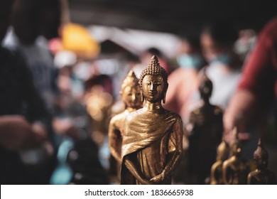 Buddhists Make Merit, Pay Coins In The Monk Bowls In Temple . Selective Focus.
