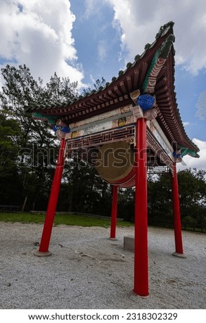 Buddhists prayer drum on the Ci'en Pagoda at Sun Moon Lake in Taiwan, the pagoda is a magnificent structure offering breathtaking views. It stands tall and serene, symbolizing peace and tranquility Stock fotó © 