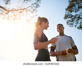 Buddy up for the best. Shot of a fit young couple working out together outdoors. - Powered by Shutterstock