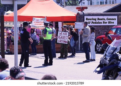 Bude, Cornwall, UK. 3rd August, 2020. Drag Queen Story Hour Protest. Protester Signs Held Up. Police Attend.