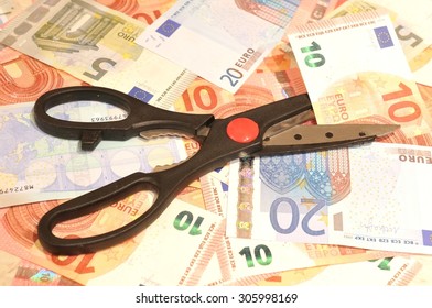 Budget Cut Concept With Scissors And Euros