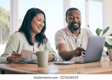 Budget, laptop and interracial couple planning home finance, savings or mortgage and taxes together in the living room. Couch, sofa and people review financial insurance document or paperwork - Powered by Shutterstock