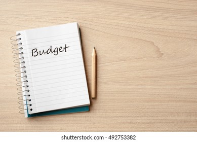 budget on notebook on desk