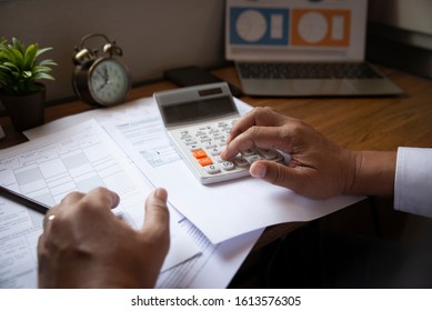 Budget Planning Concept,Accountant Is Calculating Company's Annual Tax.Calendar 2020 And Personal Income Tax Forms For Those Who Have Income Under US Law Placed On Office This Is The Season To Pay Tax