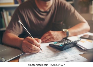 Budget and Tax planning concept, Accountant Hand is calculating company annual tax and using calculator. Personal income tax form for who have income under US law, season to pay tax.