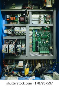 Budva, Montenegro - 01 august 2020: Elevator control board. Industrial microcircuit, printed motherboard with transistors and fuses and microprocessors.