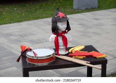 Budyonovka On A Mannequin, A Drum And A Red Tie, A Symbol Of The Pioneers.