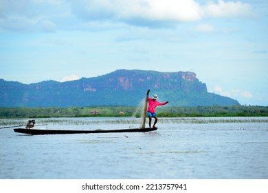 Bueng Khong Long Reservoir, Bueng Kan Province, Thailand, 10 September 1995 : A Local Fisherman Use His Fishing Net To Catch Various Kind Of Fishes In Big Fresh Water Lake, At North-east Of Thailand.