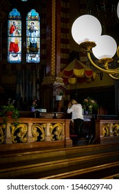 Buenos Aires, Argentina - 10/27/2019: A Woman Praying At Maria Auxiliadora Basilica. Built Between 1900 And 1910, It Is One Of The Largest Works Done By The Salesians Of Don Bosco In Argentina