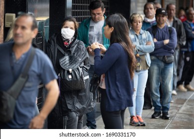 Buenos Aires, Argentina - April 02, 2020: Unidentified People Doing Long Lines To Get Food And Get Into Banks In A City Under Quarantine In La Matanza In Buenos Aires, Argentina