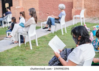 Buenos Aires, Argentina; April 2, 2021: People Of Different Ages At A Reading Activity Using Masks And Keeping Distance For The Prevention Of Covid, During The Felba, Publishers And Bookstores Fair