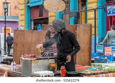 BUENOS AIRES, ARGENTINA - August 28 2016: Street Food Being Prepared In La Boca Disctrict Of Buenos Aires In Argentina