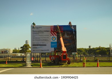 Buenos Aires, Argentina, February 4, 2021. Jorge Newbery Airport, They Change The Poster That Announces The Work In The Airpark Of The Ciudad Autónoma De Buenos Aires.