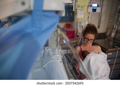 BUENOS AIRES, ARGENTINA - Mar 10, 2016: A mother holds her two days old premature son