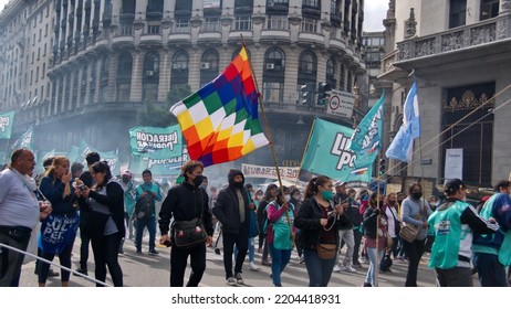 BUENOS AIRES, ARGENTINA - 
MARCH 24, 2022: People In A Procession Carrying An Indigenous Flag On The Day Of Remembrance For Truth And Justice