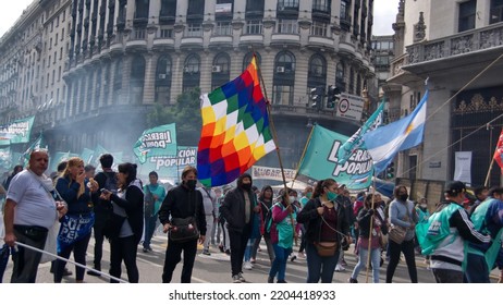 BUENOS AIRES, ARGENTINA - 
MARCH 24, 2022: People In A Procession Carrying An Indigenous Flag On The Day Of Remembrance For Truth And Justice