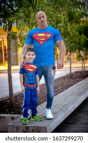 Buenos Aires, Argentina - March 5th 2019: Muscular Father And Son In Matching Costumes In Buenos Aires