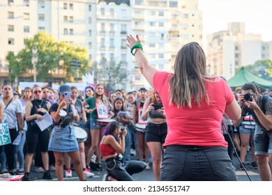 Buenos Aires, Argentina; March 8, 2022: Manuela Castaneira, National Leader Of Nuevo MAS And Las Rojas, Seen From Behind Cheering A Group Of Women During The National Feminist Strike.