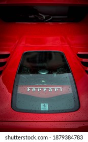 Buenos Aires, Year 2017: Close Up Of Rear View Of A Red Ferrari 458 Spider. V8 Engine Under The Hood, Wet Body. Italian Supercar. High Performance Car.Design By Pininfarina.