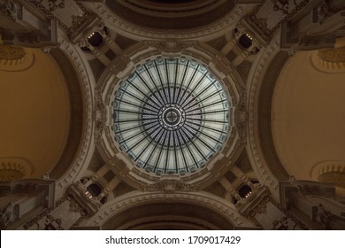 BUENOS AIRES/ARGENTINA;11 16 2017: Stained Glass Circular Cupola. Interior Decoration In Early 20th Century Building Is Rich In Iron . Geodesic Dome Of 4 Points In Stained Glass, Capitals In Plaster