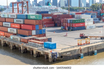 Buenos Aries /Argentina - January 19, 2020. Cargo containers moved by cranes are stacked around  Puerto Madero awaiting shipping to other countries .