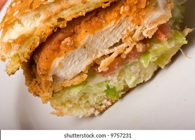 buffalo bbq chicken sandwich on a white plate
