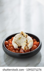 Buffalo Burrata Mozzarella Cheese Ball With Cocktail Tomatoes, Olive Oil And Balsamic Vinegar On Black Plate