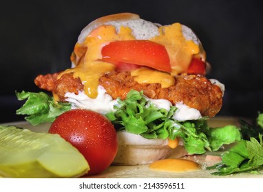 Buffalo Chicken Slider with lettuce, tomato, mayo and special sandwich sauce