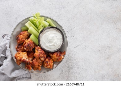 buffalo chicken wings with celery and ranch sauce - Shutterstock ID 2166948711