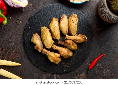 Buffalo Chicken Wings On Black Stone Plate Top View