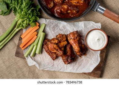 Buffalo Chicken Wings On Food Background With Vegetables Cooking Ingredients. Flat Top View, Overhead.