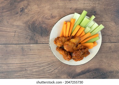 Buffalo Chicken Wings On A Wooden Table With Room For Copy