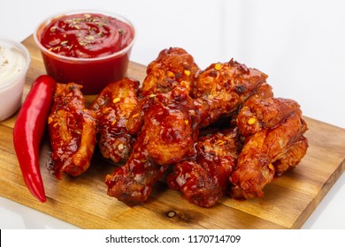 Buffalo Chicken Wings With Sauce And Pepper