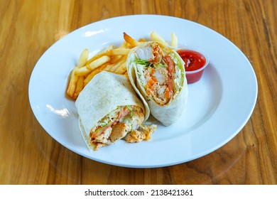 Buffalo chicken wrap with French fries
